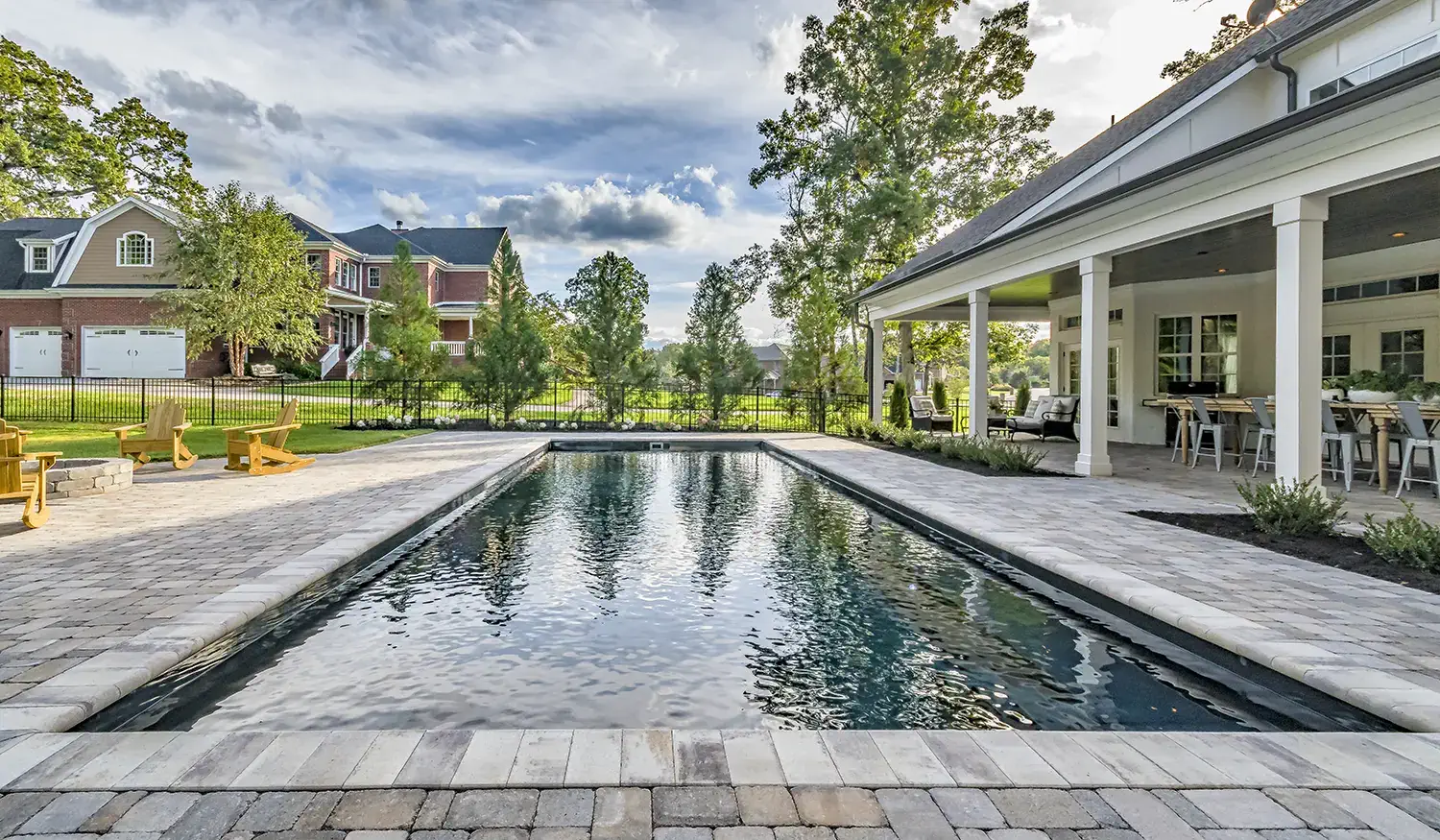 A black fiberglass swimming pool may just be the thing to take your backyard oasis up a notch.