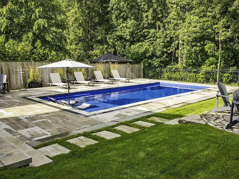 Courtland Landscape and Grounds fiberglasss pool installation near Ontario.