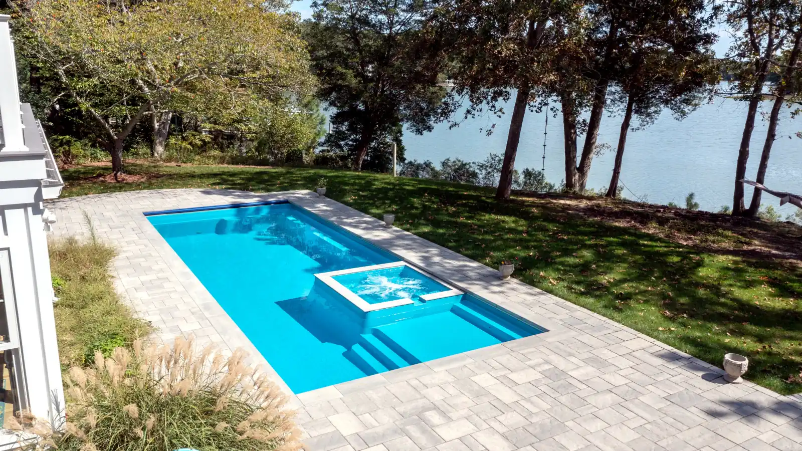 Imagine Pools Exquisite fiberglass pool and spa, aerial backyard view