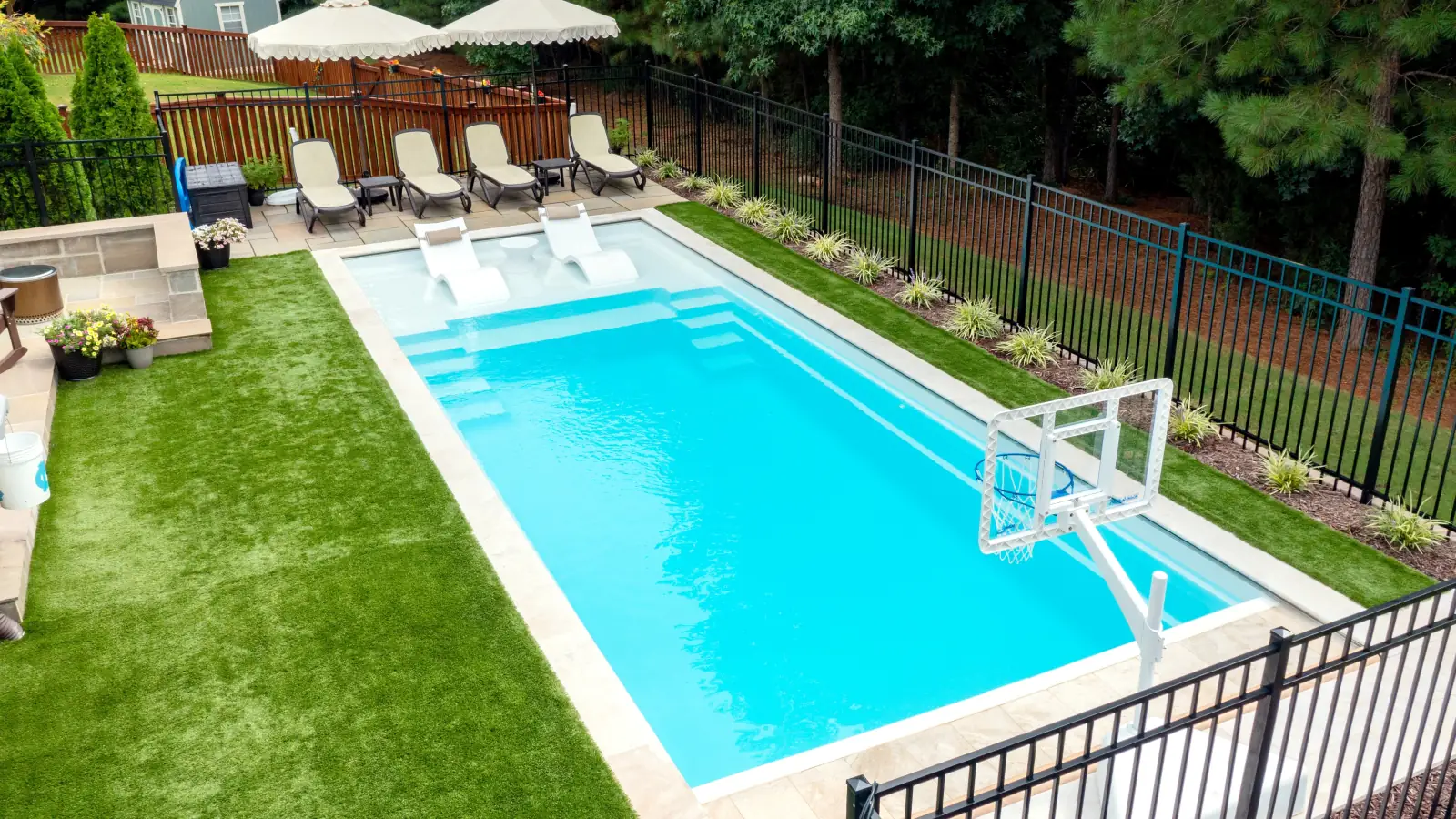 Imagine Pools Freedom with Splash Pad fiberglass pool, aerial backyard view