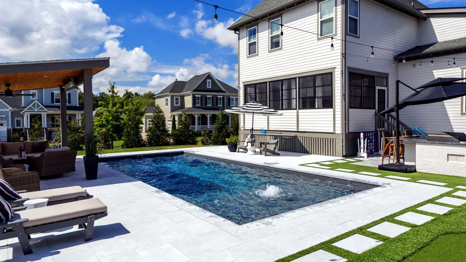 Imagine Pools Illusion fiberglass pool and spa, angled backyard view