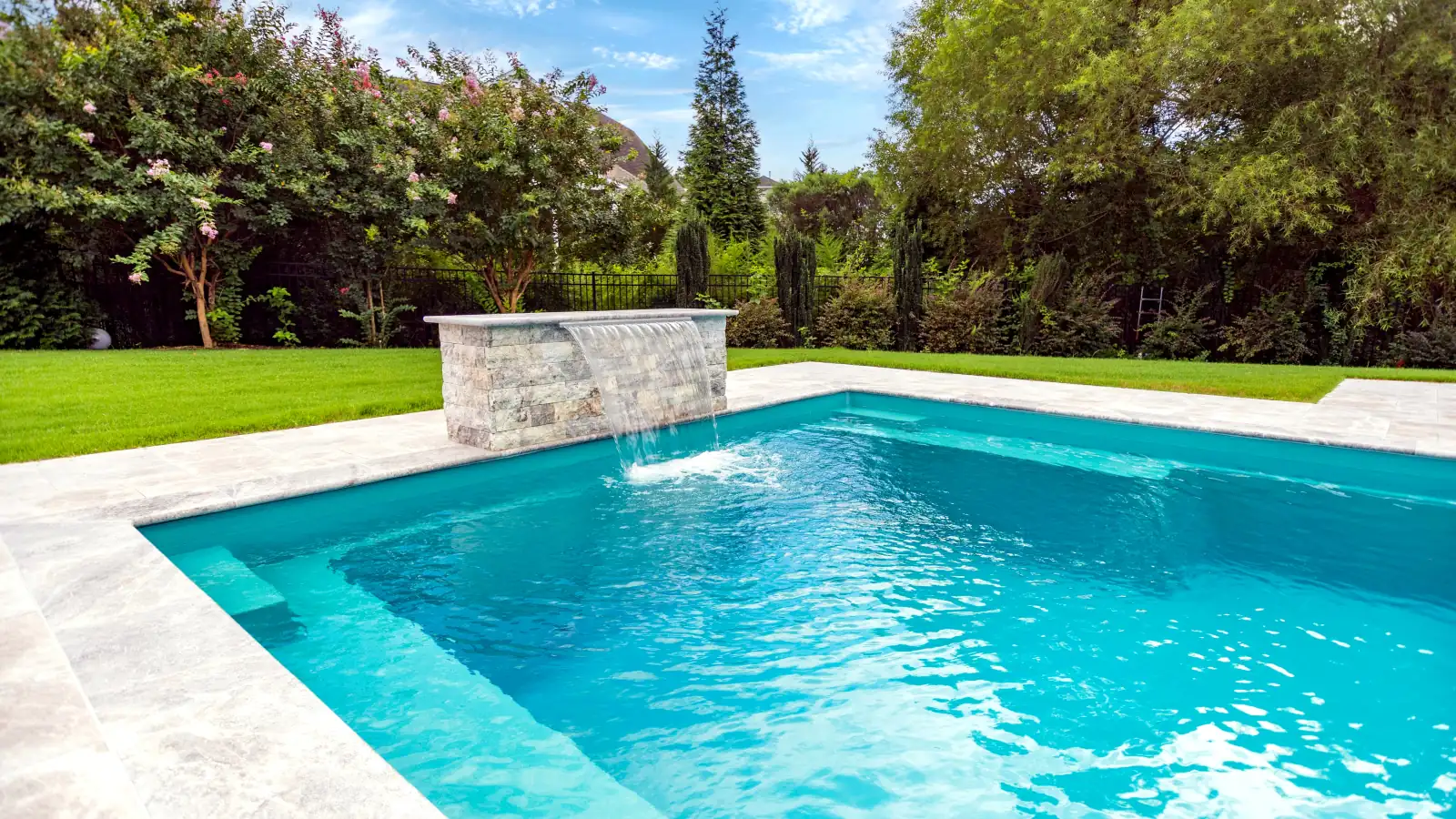 Imagine Pools Illusion fiberglass pool with raised water feature