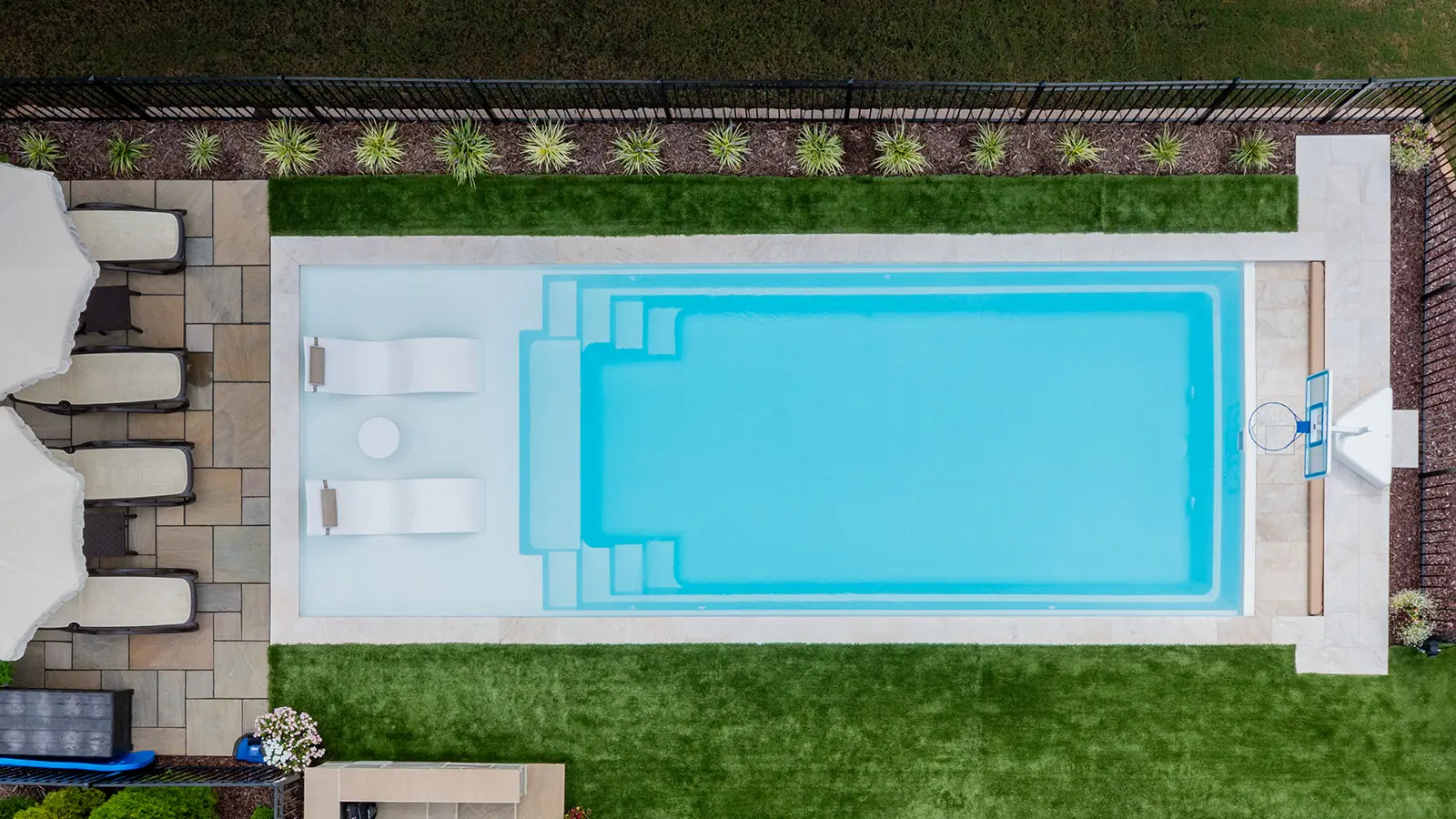 Imagine_FreedomSplash34-SS-Drone3 (1) The Imagine Pools Freedom with Splash Pad Fiberglass Pool