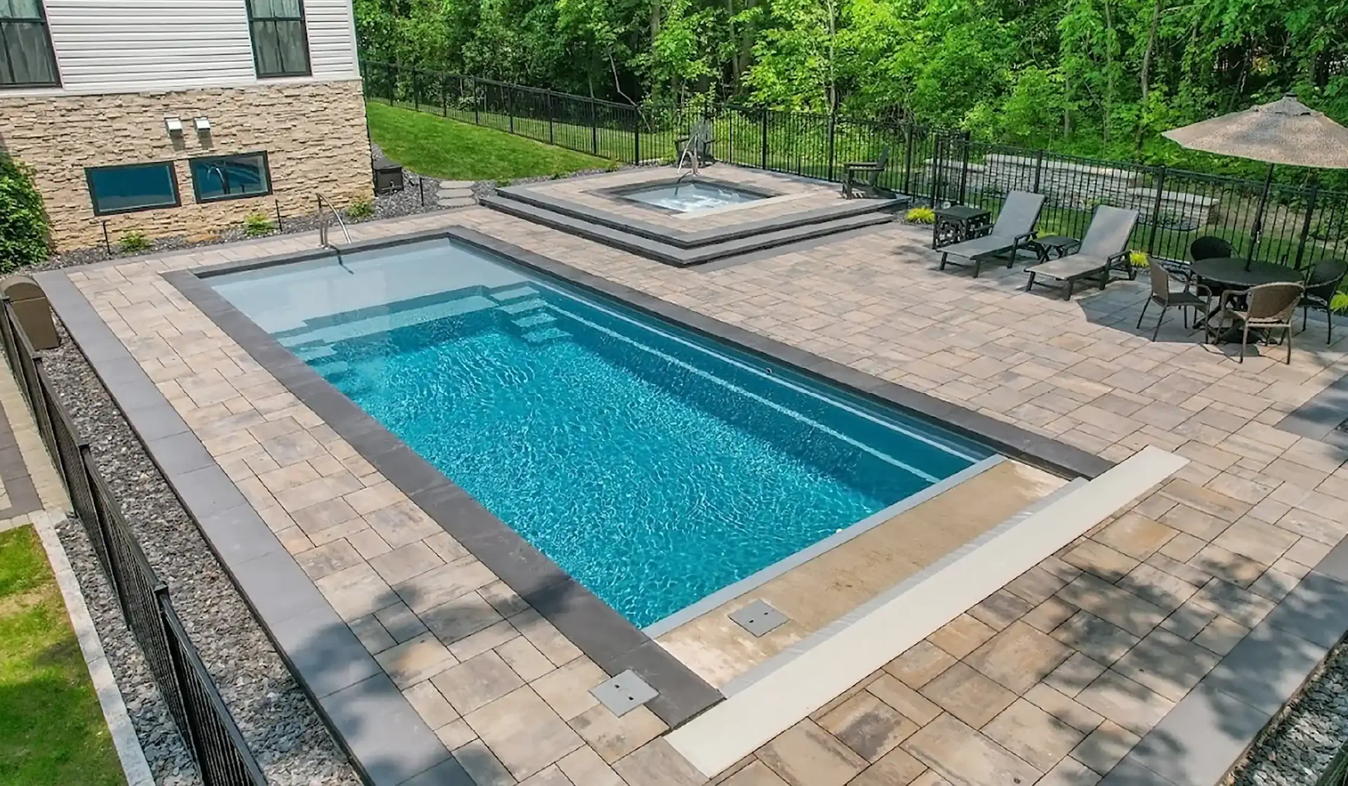 imagine pools june 2026 pool of the month: michigan fiberglass pool and spa build by GLC landscaping & pools